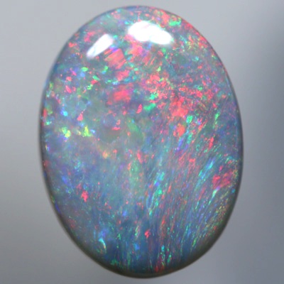 SOLID SEMI BLACK OPAL Sparkles of bright red over green SEE VIDEO